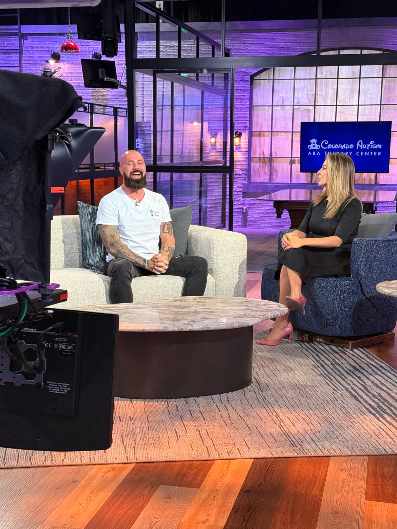 Ryker on the 9News Colorado & Company set, with the Colorado Autism ABA Therapy Center graphic on screen